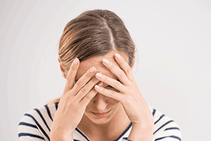 The Sneaky Warning Signs a Migraine Is Coming—and How to Stop Them