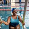 Smiling Woman Swimmer Entering Pool