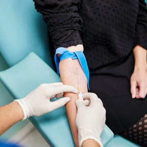 Doctor Taking Blood From An Anonymous Woman