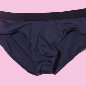 Men's Silk Briefs In Navy Blue On A Pink Background. Underwear, Underpants, Sexy, Hot And Sportswear Concept.