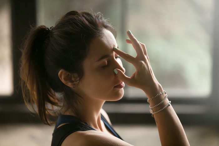woman doing breathing exercise