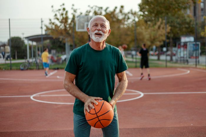 One Senior Player on Outdoor Basketball Court