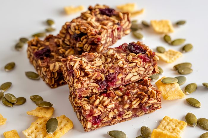 A photo of three granola bars on a white background