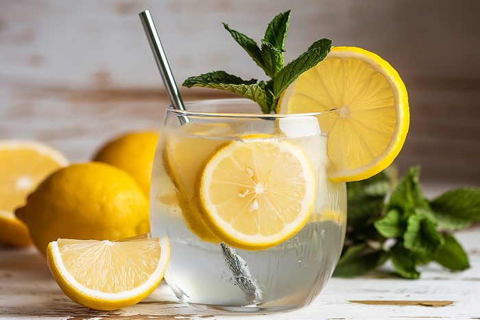 A Photo Of A Cocktail With Fresh Wet Lemons